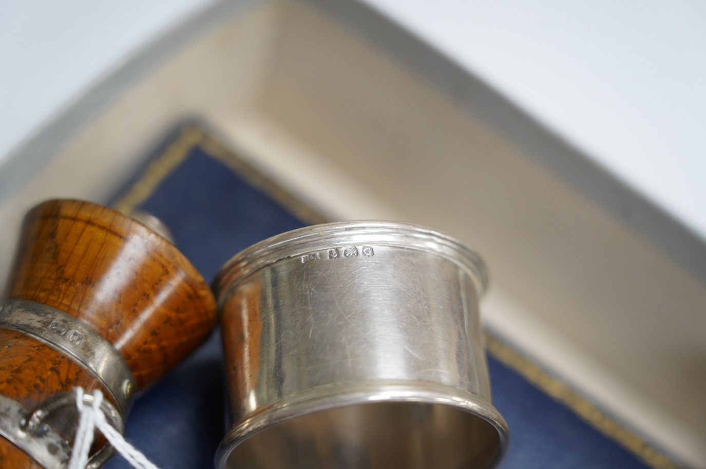 Small silver to include a cased Victorian silver Queens pattern christening trio, London 1837, four various silver napkin rings, a plated napkin ring, two condiments and a silver mounted wooden 'milk churn' pepper mill.